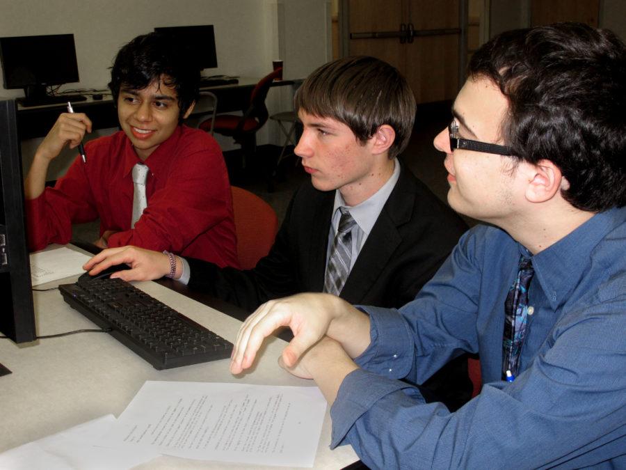 Seniors Francisco Ordaz, Wayne Winski and Tomer Braff practice before a computer science competition at UTD. Photo by Angelica Fisher