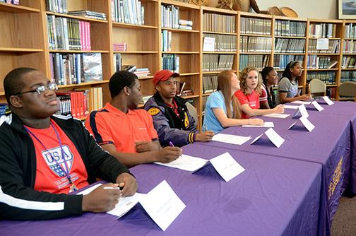 Senior athletes sign with colleges on Spring National Signing Day. Photo by Chyenne Fortson