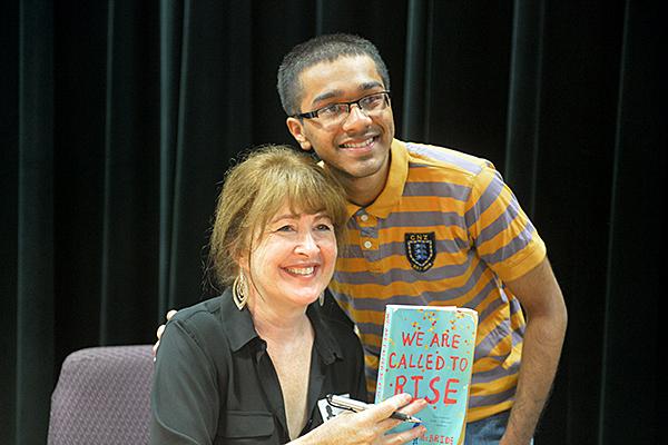 Junior Saminul Haque poses with Richardson Reads One Book author Laura McBride in the Black Box. Photo By CLAIRE MCSHANE
