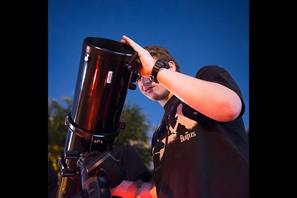 Senior Max Poole uses the science departments new Celestron Advanced VX telescope to look at constellations. Photo by Haley Yates
