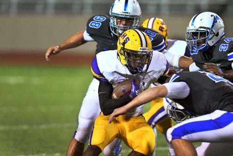 Senior Deon Gallington attempts to evade the Midlothian tackler. The Eagles are looking forward to the rivalry game against Pearce HS, despite injuries on the team. Photo by Ryan Durbin