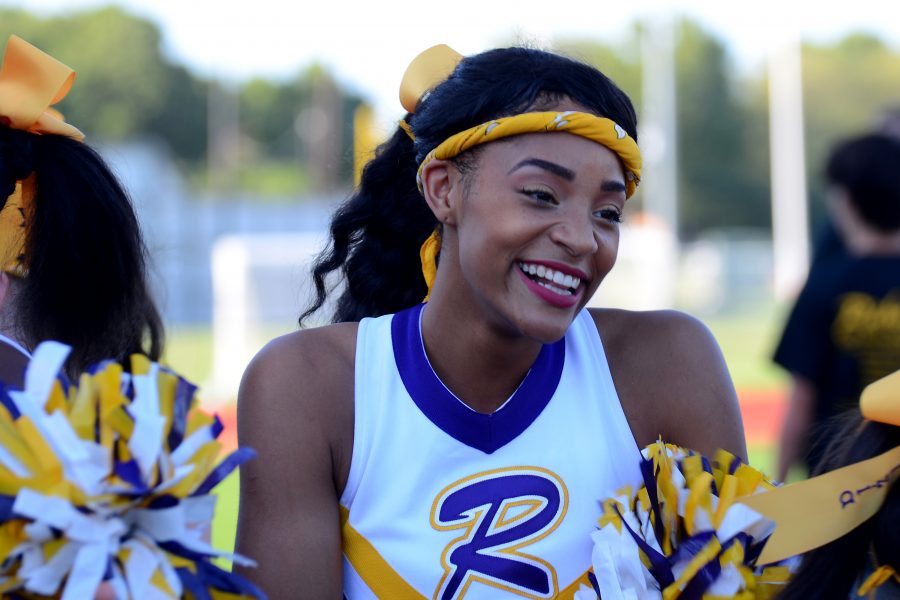Junior Jia Anderson laughs with the other cheerleaders at the annual picnic. Photo by Zee Vaughn