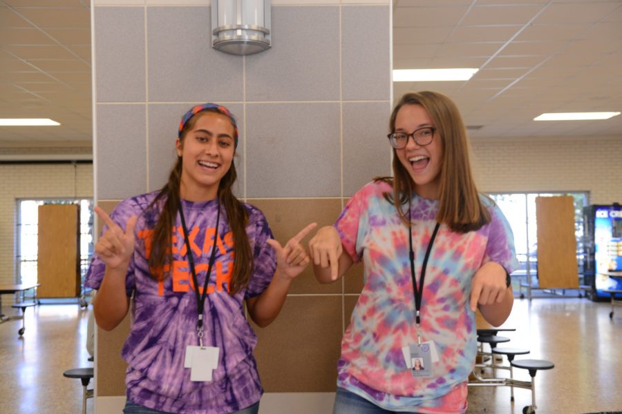 Seniors Victoria Winship and Maddie Hatfield sport tie dye shirts to show their spirit for homecoming week. Photo by Brantley Graham