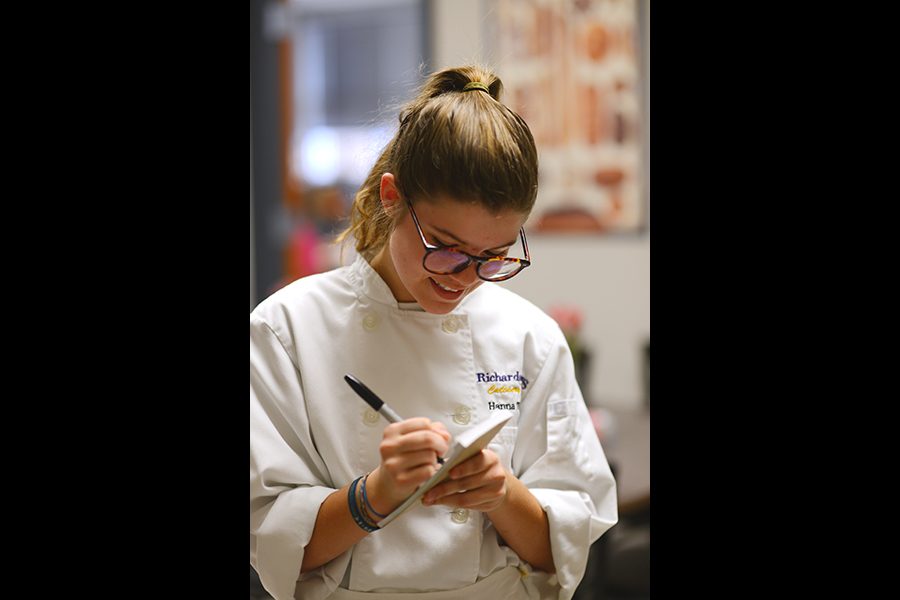 Culinary Magnet senior Hanna Thames records an order for a meal during Eagle Cafe. Photo by Daphne Lynd