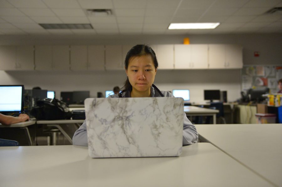 Senior Emily Chen volunteered for the Digital Divas competition, where girls solve levels with their knowledge of computer science. Photo by Brantley Graham