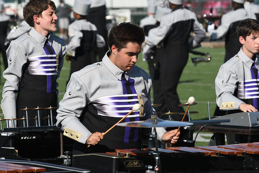Senior front ensemble captain, James Camp, performs at the Desoto Marching Competition. The band placed third for the second consecutive year. Talon photo by Ali Nosrat