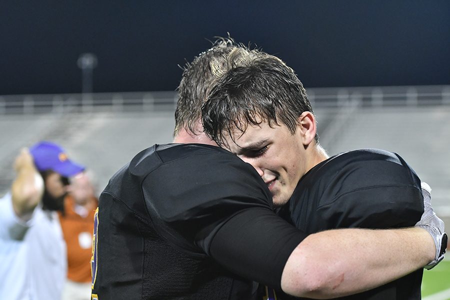 Seniors Jordan Wander and Nic smith embrace after a 42-37 victory over W.T. White, ending a 21-game losing streak. Talon photo by Daphne Lynd
