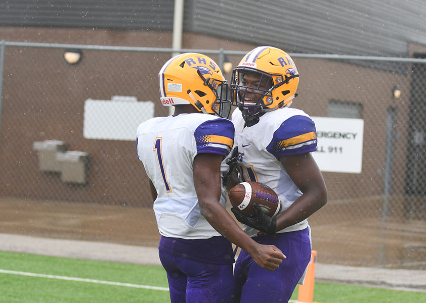 Stone Carter and Marcus Johnson celebrate after one of four touchdowns the pair combined for in the Eagles 28-14 win over Samuell HS in Pleasant Grove Saturday afternoon. Photo by Audrey Anders