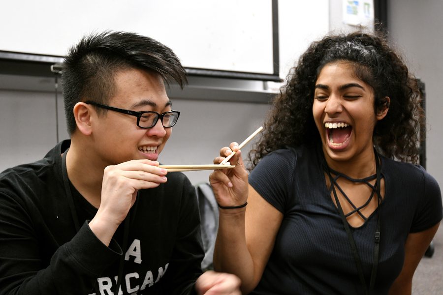 During an Asian Student union meeting secretary of the club, Andrea Joseph, battles Brandon Vo in a chopstick challenge. “It is different from other clubs I’ve been in because the leadership team actually plans meetings/activities that literally anyone would enjoy. I feel like ASU does whatever they can to make the club enjoyable for members, free of expense and the club is extremely welcoming and inclusive,” Joseph said. Talon photo by Jordan Buta 