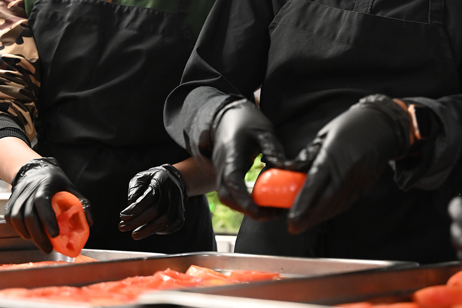 Culinary students Ogo Kujore and Mistura Owodunni prepare bell peppers for their biggest catering event of the year. 
"Because of this catering, if I wanted to get a job in this area, I know what to do," Kujore said. "And that gives me an advantage over someone else."
Culinary Magnet prepares food for their catering event hosted by the Hospitality program.