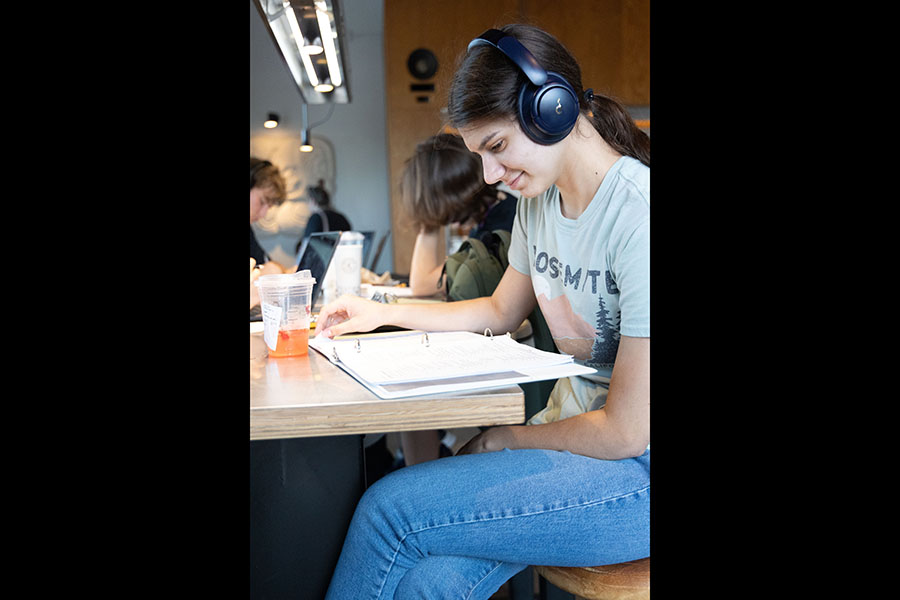 Salutatorian, Celia Schaefers, studying for Academic Decathlon with her class at Chipotle. "I'm happy with the work I've put in," Schaefers said "I don't think pushing for another quarter would do too much." The new GPA policy finalizes GPA's by the end of first semester, a quarter earlier than the previous GPA policy. Photo credit: Jana Pulak