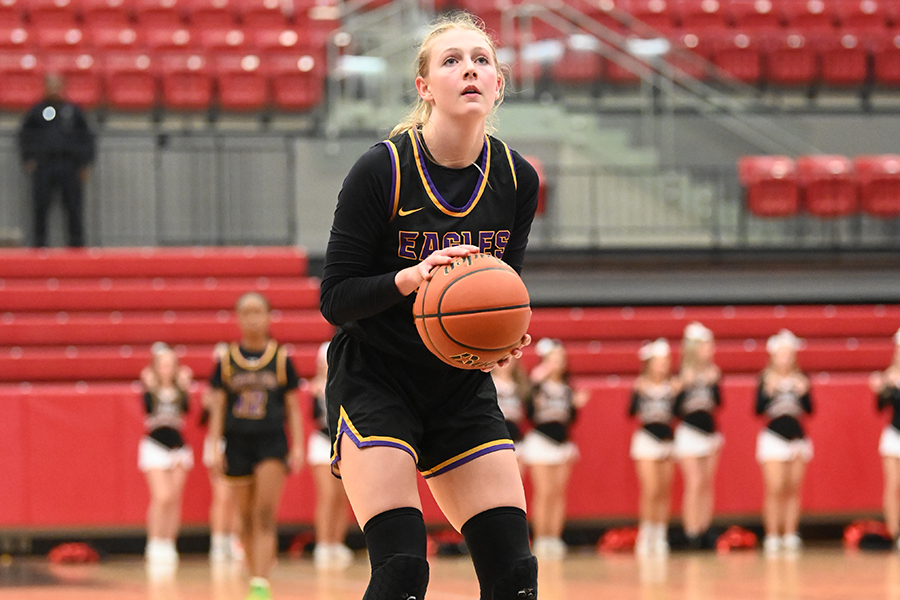 Varsity basketball player Averie Farrell prepares to make a shot in a game against Little Elm, not long before winning an award for her community service hours despite her rigorous basketball schedule. 
"Managing basketball and community service does get a little bit difficult, especially when we're in-season, but it's just like time management and thinking about doing both because they’re both a priority," Averie said.
Averie's commitment to community service as a varsity basketball player has been recognized by the 'Making a Difference On and Off the Field' campaign.