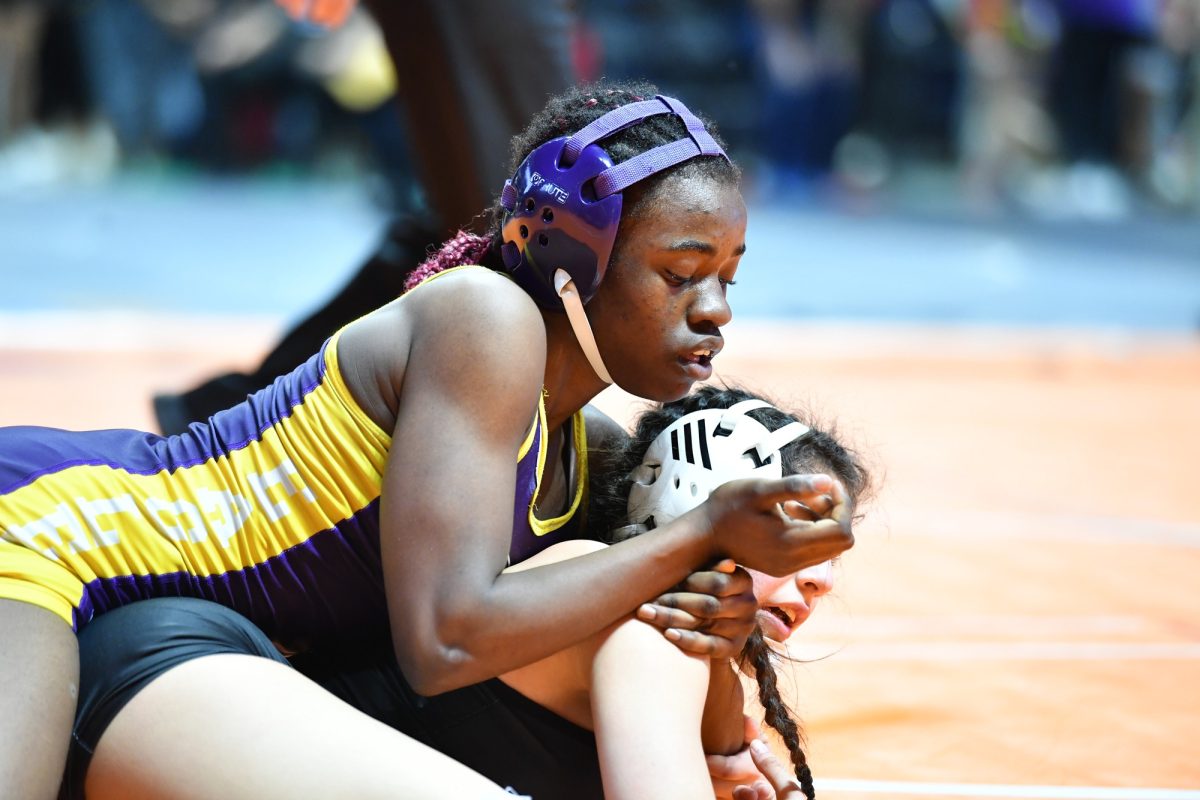 Junior Vanessa Egorah competing at state wrestling match. Photo by Jesus Serrano.