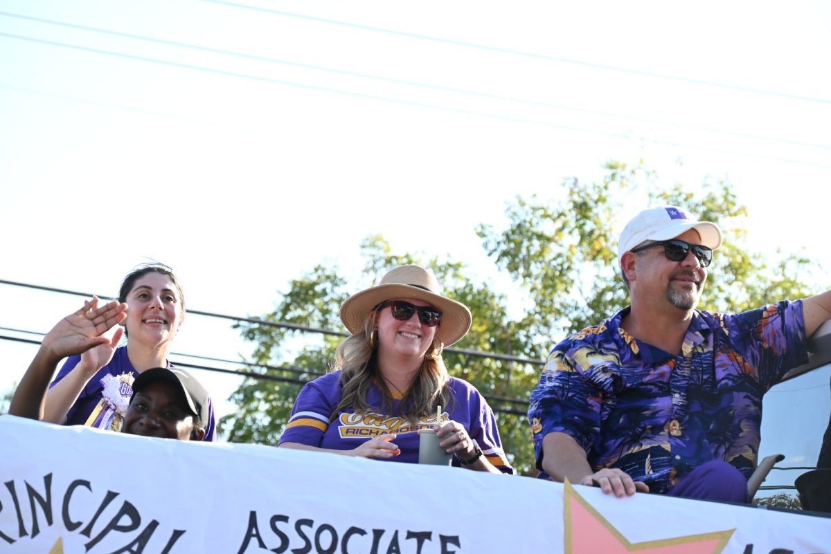 Principal Chris Choat rides on a float with his administrative team in annual Homecoming parade. Talon Photo by Xaviar Sheehan. 