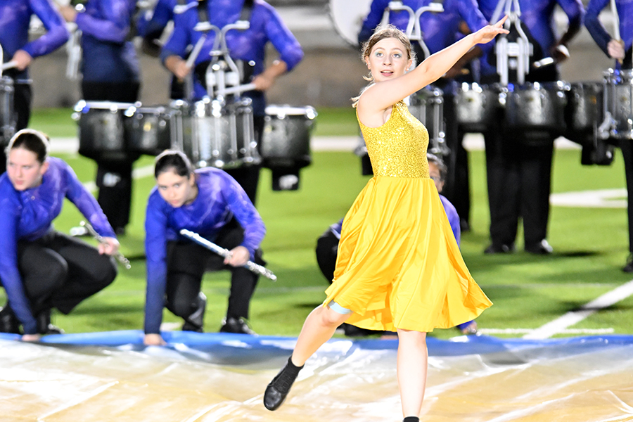 Senior Hannah Chapman performs during the Golden Eagle Band's halftimes show: Category 5 at the UIL Area semi-finals. Talon photo by Henry Fair.