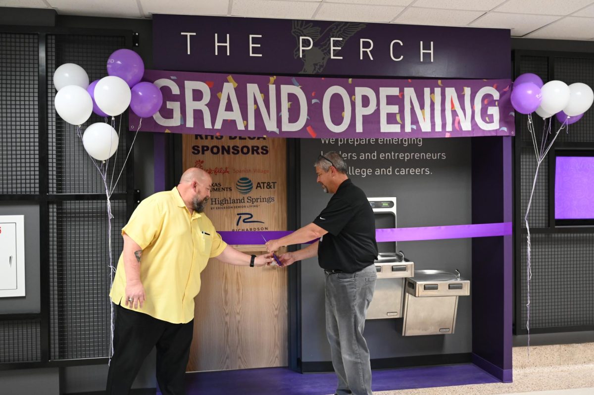 Principal Chris Choat and assistant principal Bill Parker cut the ribbon for the Perch's grand opening. Talon photo by Ilan Ahmed.