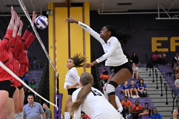 Varsity volleyball player Mackenzie Ratcliff spikes the ball for the winning point in the team's first set against Lake Highlands. Ratcliff broke the record for all-time career kills at RHS with 1,093 kills, becoming the first junior to do so. "I was not prepared to break this record," Ratcliff said. "It’s just something that adds on and builds up." Talon photo by Ray Brosnahan