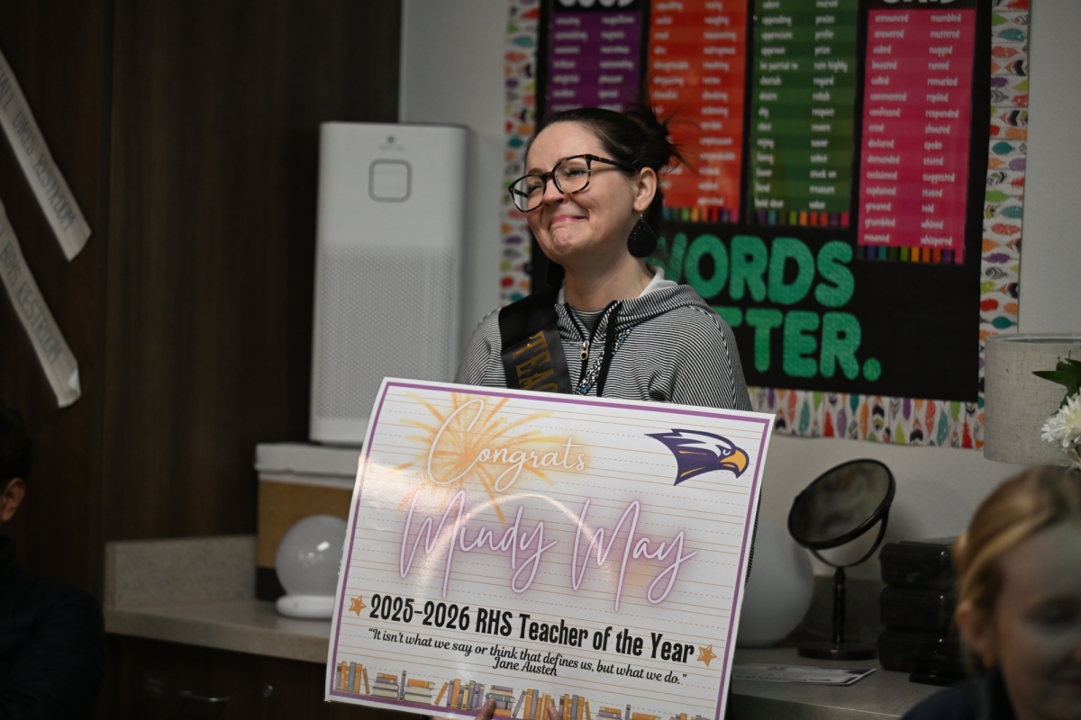 English Department Chair Mindy May smiles after hearing Principal Chris Choat speak a few words on why she was chosen for "Teacher of the Year." Talon photo by Hudson Morris