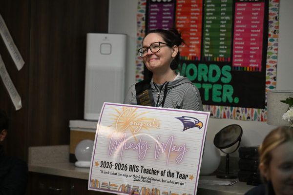 English Department Chair Mindy May smiles after hearing Principal Chris Choat speak a few words on why she was chosen for "Teacher of the Year." Talon photo by Hudson Morris