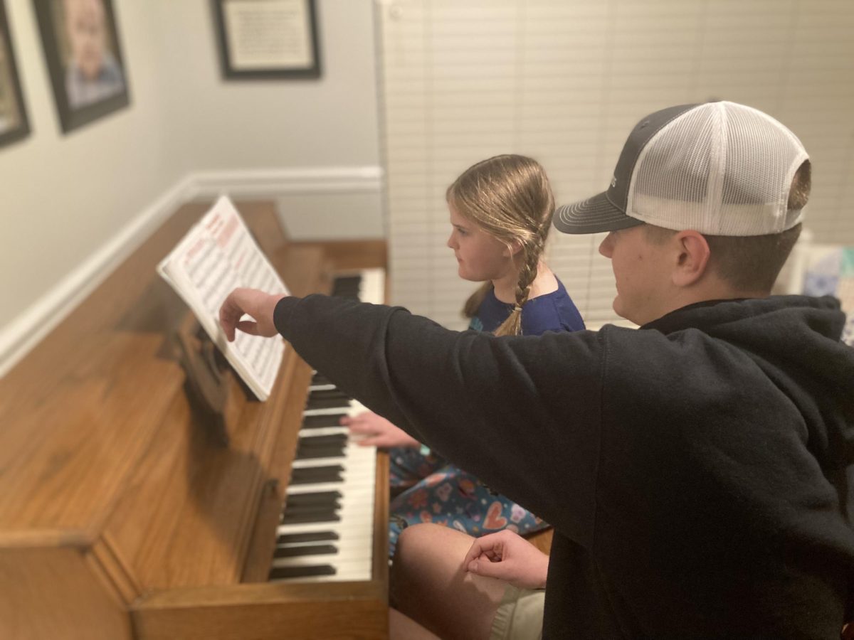 Leo Eves points out the specific notes on the music sheet to his sister as he teaches her piano. After learning piano for eight years, Leo spends his free time after school teaching piano to elementary school kids after being encouraged by his personal piano teacher to do so. "I did not have complete confidence in myself, but it was a lot of help having it be my sister and I could figure out what I needed to do, exactly what I needed to teach them," Leo said.