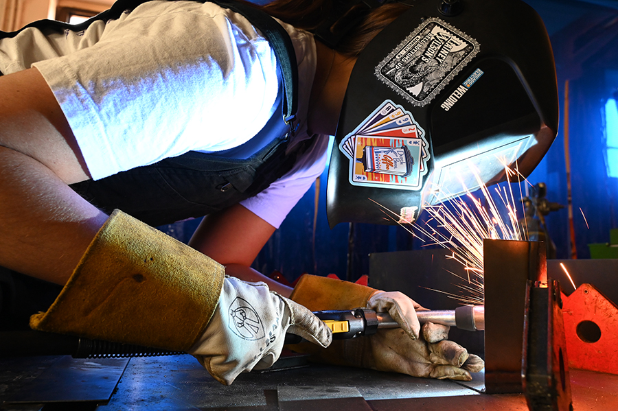 Junior Madison Frischhertz welds a thin sheet of metal for one of the Ted Talk sign's letter in the manufacturing shop. Manufacturing students have been working on a Ted Talk sign since Thanksgiving break for an upcoming program where magnet students perform Ted Talks. “The first half of it is complete, and we’re excited," Frischhertz said. "It’s almost done." Talon photo by Ilan Ahmed