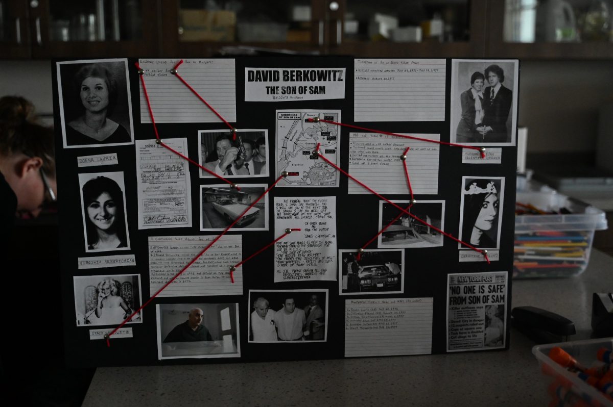 Senior Cory Houghton made his connection board about David Berkowitz, also known as "The Son Of Sam." Forensic Science students made connection boards for a serial killer project to learn about their upbringing and how their minds worked. "It also focuses on their life as they were a serial killer," Forensic Science teacher Lauren Green said. "So what they did, what kind of victims they went after, where they lived and all those different types of things." Talon Photo by Lola Maternowski