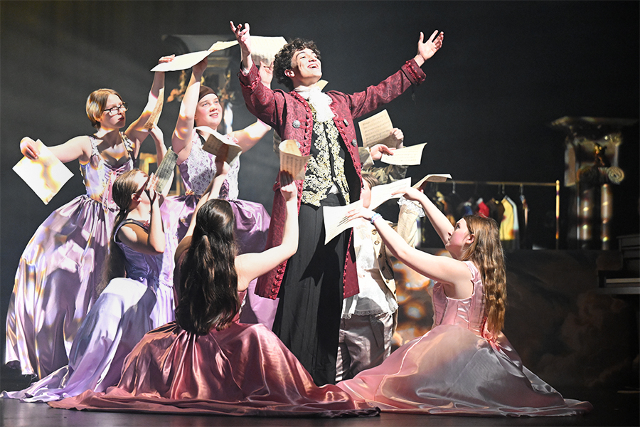 Sophomore Clay Morgan, who plays Salieri, performs in a scene "Amadeus" where he finds out about Mozart's detailed writing. The Theatre Collective performed the show for the UIL One Act Play competition advancing to the Bi-District round at the Arlington PAC. "I have seen my students grow in a lot of different ways on this production, from the basics of acting and the techniques that they use to their emotional vulnerability on stage," Theatre Director Madison Armstrong said. Talon photo by Henry Fair